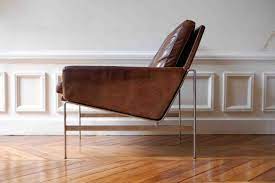 Low slung, comfortable angle at back natural cow hide leather and teak wood handcrafted 25 1/2 l x 31 w x 27 h supports weight up to 250 l Leather Lounge Chairs Ideas On Foter
