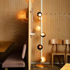 The result is a slightly distorted sphere with an interior landscape. Floor Standing Lamp 28 Series Bocci Brass Blown Glass Contemporary
