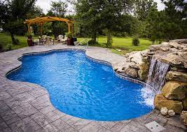 cancun 27a viking pools free form design poolside and outdoorl living spaces collinsville ok by viking pool landscaping saltwater pool pool waterfall