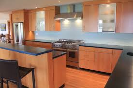 Modern Kitchen With Douglas Fir Veneer And Concrete Counter Tops Glass Subway Tile Backsplash Countertops Kitchen Island Countertop Concrete Countertops