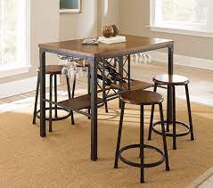 This table puts a rustic twist on the once traditional dining experience with its beautiful frame finish. 20 Well Designed Pub Tables With Wine Storage Home Design Lover