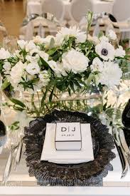 If you're keeping it simple, you may only need bouquets. A Chic Black And White Wedding At The Arlington Estate Wedluxe Media Black Wedding Table White Wedding Theme White Wedding Flowers