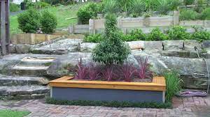 Raised garden tables with enclosed storage area. Build A Garden Bed With Seat Youtube