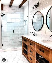 Who else totally loves this #bathroomvanity modern farmhouse bathroom. Modern Farmhouse Bathroom White Tile And Shiplap With Wood Cabinets Masterbathro Modern Bathroom Remodel Modern Farmhouse Bathroom Farmhouse Bathroom Decor