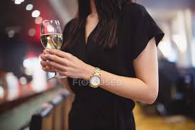 Check spelling or type a new query. Mid Section Of Woman Holding Wine Glass In Restaurant Drink Wrist Watch Stock Photo 225325670