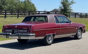 Image result for Garnet Maroon 1931 Oldsmobile