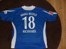 Gym bags and face masks have been created from old, recycled jerseys in recent months; Arminia Bielefeld Home Football Shirt 2007 2008 Sponsored By Krombacher