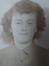Virginia Mattie stands in the yard of her Main Street home. She was a well  known personality in the Antigonish community; known for having an  impressive garden of heritage plants and shrubs.