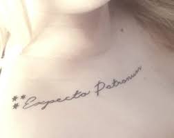 On her left forearm, she sports two guns with wings, showing both sides of her country personality. Tattoos Org Expecto Patronum Done By Jason At Big Country