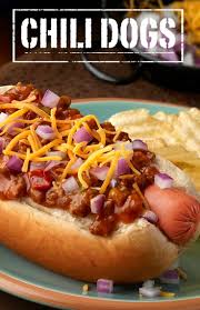 This comforting, economical, easy to make hot dog casserole with beans, green bell pepper, onions, and cheese is sure to be a hit with the whole family! Chili Dogs Recipe Chili Dogs Chili Dog Chili Recipe Campbells Recipes