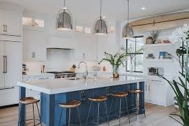 Check spelling or type a new query. This Coastal Inspired Home Features A Denim Blue Island As The Focal Point Of The Contrast Beach House Interior Design Blue Kitchen Island Beach House Kitchens