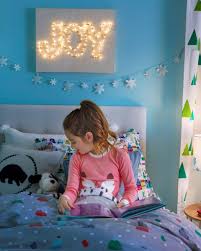 Garland, fake snow, and adorable christmas village houses. Christmas Decorations Decorating Ideas Parents
