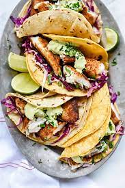 Served with rice, beans, lettuce, toamatoes and avocado slices. Baja Style Fish Tacos Get A Blackened Cajun Fix Cooled Off With An Avocado Cilantro Tartar Sauce And Cabbage For A Fast And E Food Blackened Fish Tacos Recipes
