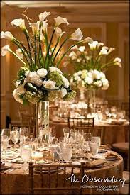 The center piece has 10 white calla lilies, 15 wips of lily brass and 10 ruscus. Pin On For The Love Of Flowers