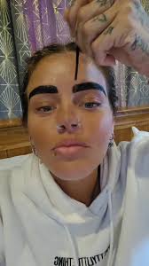 Examining Products in a Cozy Bedroom Setting