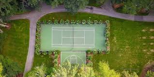 Information about planning for a tennis court in your backyard. Steps To Building A Tennis Court In Your Home John Ryan