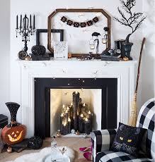 Wayfair also carries plenty of other halloween party supplies to help make. Lighted Black Scented Candles Inside Fireplace During Daytime Halloween Mantel Decor Halloween Mantel Halloween Fireplace