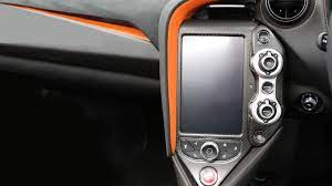 Mclaren 720s carbon fiber steering wheel with extended shift paddles. Mclaren 720s Forged Carbon Fiber Center Console Media Unit Cover Gps Touchscreen Frame Dmc