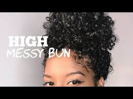 If you have bangs and curly hair, this is going to be your new go to messy bun look. While Some Women Love To Embrace Their Shrinkage Some Prefer A Stretched Out Look To Curly Hair Bun Styles Natural Hair Bun Styles Curly Hair Styles Naturally