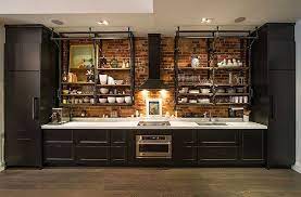 Not only can they hold a lot of weight (your stand mixer can find a home there, no problem), but they add a bit of an industrial look that can really complement your stainless steel appliances. Kitchen Narrow Industrial Kitchen White Island With Wooden Countertop 8 Black Pendant Lights Industrial Style Kitchen Industrial Kitchen Design Kitchen Design