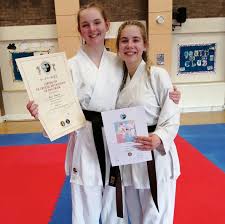 BLACK BELT IS AMY'S TOP ACHIEVEMENT IN KARATE
