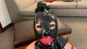 sumisa hot wife receiving a hot cumshot all over her latex mask and saying  Im your whore - XNXX.COM