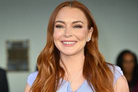 Lindsay Lohan Is Absolutely Glowing as She Cradles Her Baby Bump in New Pics  