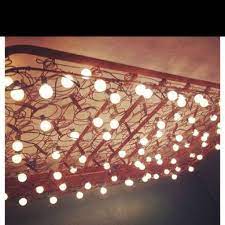 5 diy light fixtures eye catching ways to light up your home pure realty pure realty in 2021 bed spring crafts mattress springs bed springs