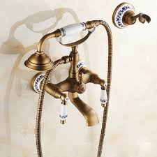 The double tub faucet functions the same as a single tub faucet. Deck Mount Antique Brass Bathtub 2 Handle Telephone Mixer Hand Shower Faucet Tap Home Tubs Shower Faucets Home Garden