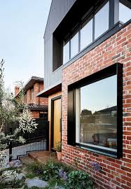 brodecky a new double story residence with strong living zone and easy ground floor access brick exterior house modern brick house house cladding