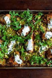 Sheet Pan Chicken With Potatoes Arugula And Garlic Yogurt Recipe Recipe Roasted Chicken And Potatoes Chicken Recipes Chicken Potatoes