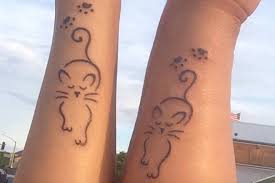 This is a unique design that is made up of pastel colors to create a beautiful cat tattoo. Simple Matching Cat Tattoo Novocom Top