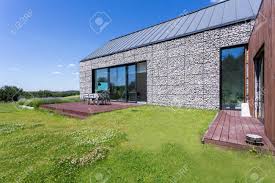 Stone house by chrofi architects is the alteration to a single story vernacular house in the rural landscape setting of northern new south wales, australia. Modern Stone House With A Big Terrace And Garden Stock Photo Picture And Royalty Free Image Image 79836820