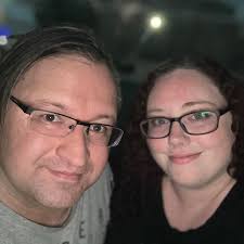 Rainy day umbrella conversation