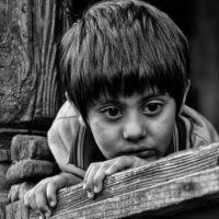 A black and white photo of a woman's eyes. Sad woman people, emotions.