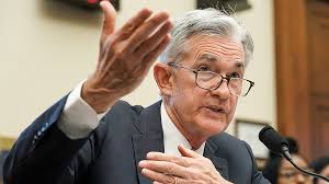 The Fed cuts while keeping its cool