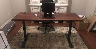 This is simply a regular desk that can rise up with a push of a button and turn into a standing desk. How To Build A Diy Adjustable Standing Desk Step By Step Photos Home Stratosphere