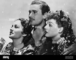 Olivia De Havilland, Errol Flynn & Ann Sheridan Film: Dodge City (USA 1939)  personaggi: Abbie Irving, Wade Hatton & Ruby Gilman regista: Michael Curtiz  01 aprile 1939 **AVVERTENZA** questa fotografia è solo