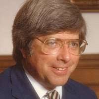 Ian M. Watson McLaughlin, president of Watson Machine International, in his  office; company brochure is