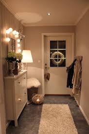 Simple Hallway Is Looking Neat And Clean White Shoe Rack Is Making Area Bigger Mirror On The Wall Is Contemporary Hallway Small Hallways Ikea Hemnes Cabinet