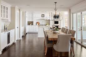 The dark wood floors serve as a great contrast for the white cabinets, but also compliment the dark grout of the backsplash. 75 Beautiful Dark Wood Floor Dining Room Pictures Ideas May 2021 Houzz