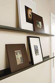 Wall shelves make empty walls and rooms look beautiful & decorated. Trace Picture Ledges In Natural Steel Modern Wall Shelves Ledges Modern Home Decor Room Board Decor Modern Furniture Living Room Wall Decor