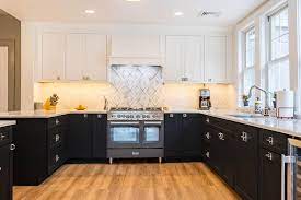 Using the black shaker cabinets for the bottom and white cabinets for the upper parts visually lightens the interior and makes the kitchen design more modern and stylish. Timeless Beautifully Balanced Black And White Kitchen Cliqstudios