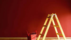 For painting dark colors over white, such as red paint over white, you would do the opposite and apply one coat of primer tinted gray. Painting Over Dark Paint Colors