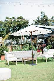 Hampton Event Hire French Linen Sofa French Linen Armchairs Oak Coffee Table Linen Tufted Ottoman White Market Umbrella Wedding Tent White Umbrella