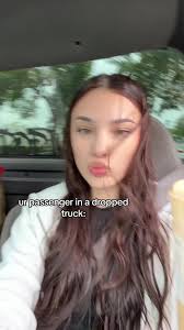 Wonen Climbing in A Window of A Truck