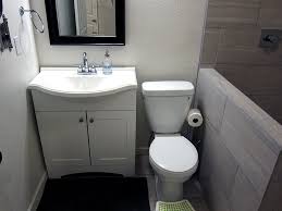 Barn wood walls and corrugated metal siding give this space a wonderful i love the small tiles in the bath; Basement Bathroom Ideas From A Diy Basement Finish Modern Gray Tile With Ikea Ca Basement Bathroom Remodeling Basement Bathroom Design Small Basement Bathroom