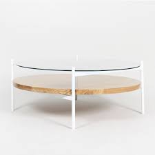 Find the perfect home furnishings at hayneedle, where you can buy online while you explore our room designs and curated looks for tips, ideas & inspiration to help you along the way. Duotone Coffee Table Round White Clear Glass Ash Wood Rouse Home