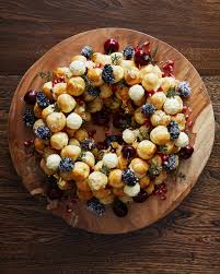 A Holiday Centrepiece Worthy Chocolate Cream Profiterole Wreath Cbc Life Recipe Profiteroles Winter Desserts Christmas Food