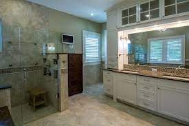 Small bathroom storage idea #1: Spa Bathroom In Soft Cream And Beige With Overhead Storage Bathroom Vanity Remodel Bathroom Spa Great Bathrooms